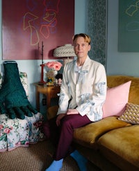 a man sitting on a couch in a living room